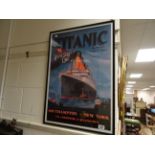 A framed White Star Line Titanic poster.
