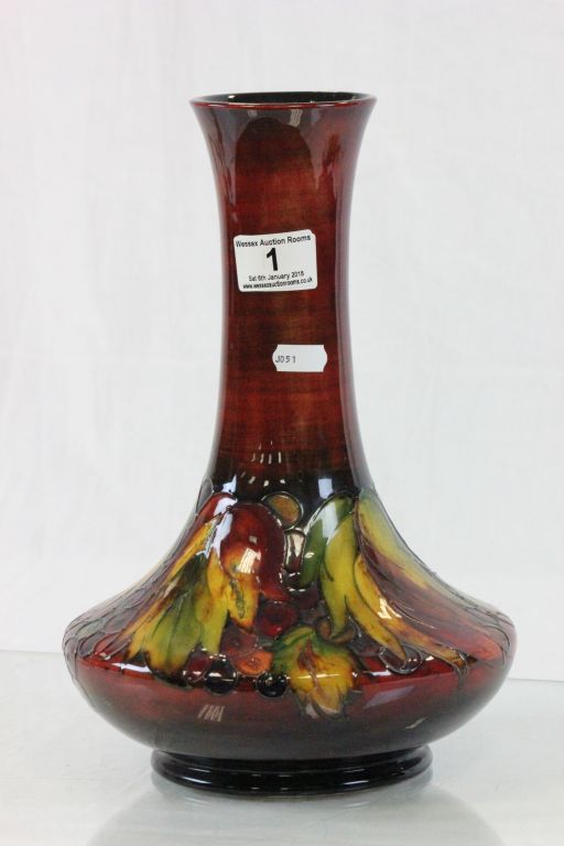 Large 1930/40's Moorcroft Flambe vase with tube lined Leaf & Berry pattern and signed to base,