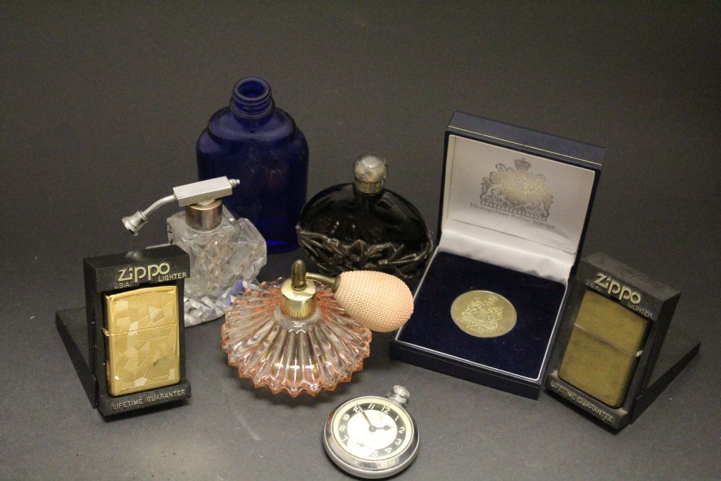 Mixed collectables to include scent bottles, Police medal, Zippo lighters and an Ingersoll pocket