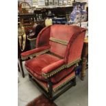 Substantial Jacobean Style Oak Wingback Armchair upholstered in Burgundy fabric with gold tassels