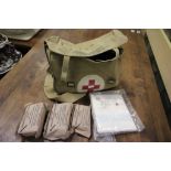 A military 1943 NCO first aid bag with some contents.