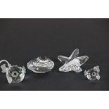 Three Swarovski crystal figures of a puffa fish, star fish, and a shell
