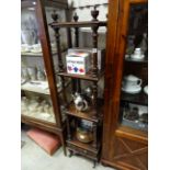 A 19th century mahogany four tier wotnot raised on turned supports with single drawer to base.