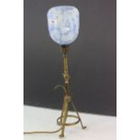 An antique gimble arts and crafts lamp with glass shade.