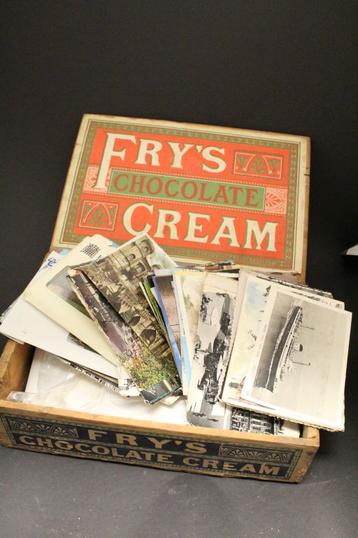 Collection of vintage Postcards in an old wooden Fry's Chocolate Cream box