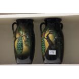 Pair of Torquay Ware three handled vases decorated with Peacocks