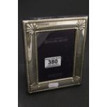 A sterling silver photo frame.