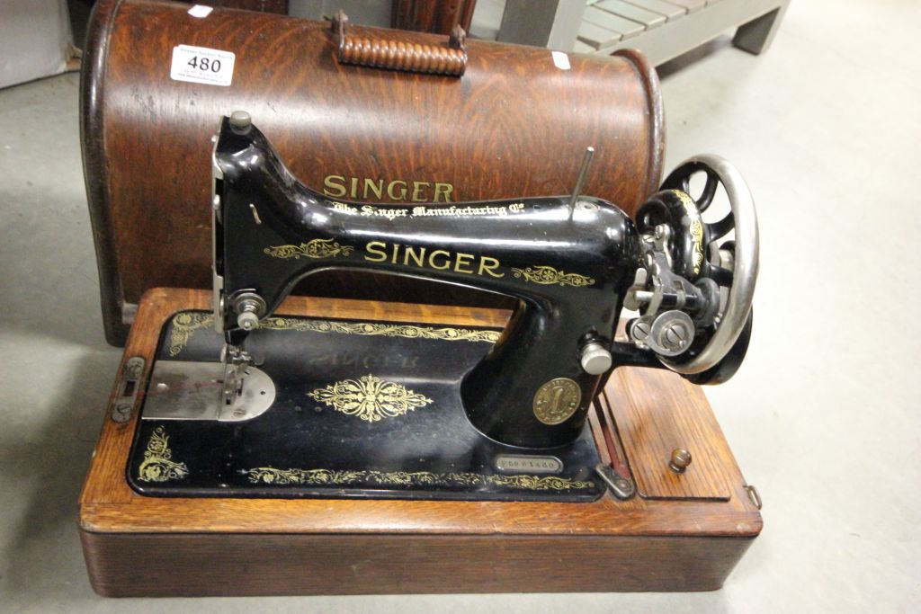 An oak cased vintage Singer sewing machine.