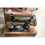An oak cased vintage Singer sewing machine.