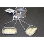 Hallmarked silver Napkin ring and two white metal decanter labels