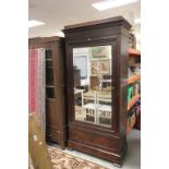 Good 19th Century mahogany wardrobe with mirrored door & two secret drawers below