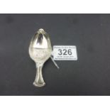 Silver caddy spoon in the form of an acorn
