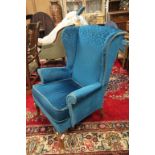Parker Knoll Wingback Armchair upholstered in peacock blue fabric