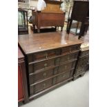 A late 18th century oak chest of two over three drawers with geometric moulded decoration raised