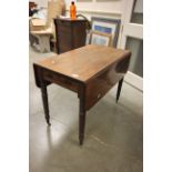 19th century Mahogany Pembroke Table with drawer to end raised on turned ringed legs and castors