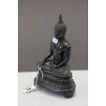 Bronze Asian Buddha statue in seated position