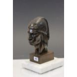 A Carved wooden sculpture of a native American indian in headdress signed A Franco mounted on a