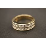 Fully hallmarked 9ct gold two channel diamond ring (50pts)