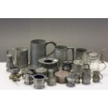 A quantity of pewter tankards etc.