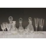 Two cut glass decanters a similar ships decanter and a quantity of glasses etc.