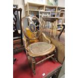Victorian Mahogany Rocking Chair, the oval back inset with bone and the shaped splat with foliage