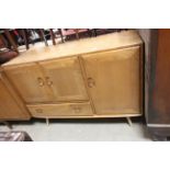 Ercol Pale Elm Sideboard comprising two cupboards and a drawer