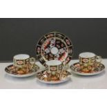 Three Royal Crown Derby Imari pattern cup & saucers, one being a trio