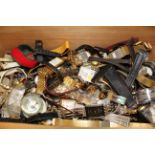 Large amount of vintage wristwatches in a wooden drawer