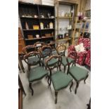 Set of Eight Victorian Rosewood Dining Chairs with Shaped Balloon Backs with scrolling leaf carved