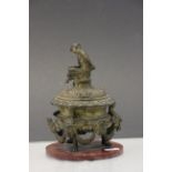 Large 19th Century ornate gilt Bronze inkwell with glass liner and Pan finial to lid