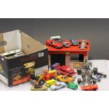 Box of playworn vehicles including Dinky and Corgi and wooden garage