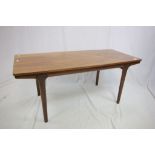 1960's / 70's Teak Extending Coffee Table with formica top draw-leaf to either end, raised on