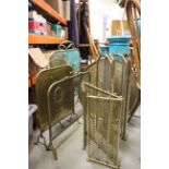 A group of brassware to include a Two fire fenders, Five Fire Screens, Charger, etc