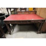 Heavily Carved Oak Desk with Red Leather Top and Two Drawers, raised on barley-twist legs and