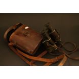 Military style pair of vintage Binoculars with leather case and carrying strap