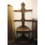 Late 19th century Oak Heavily Carved Hall Stand with turned peg coat hooks, glove drawer and