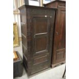 Jacobean Style Oak Panelled Cupboard, the single hinged door opening to reveal a modified interior