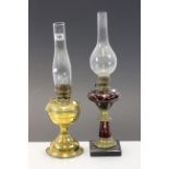 Two vintage Oil lamps, one with engraved Ruby glass overlay decoration