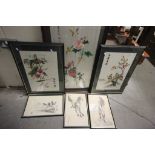 A quantity of oriental framed prints and embroidered silks .