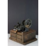 A vintage Yale key cutting machine mounted on oak base with two drawers with keys etc