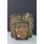 A carved and painted red Red Indian's head possibly from a fair ground