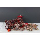 Four Maasai bead and sea shell amulet flasks and carpet style bag