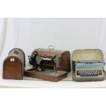 Two vintage wooden cased sewing machines to include Singer and a cased Bluebird typewriter