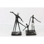 Pair of contemporary dancing figures models with bronzed effect finish