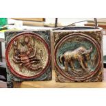 Two heavily carved and painted wooden plaques with Zodiac animals