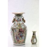 Two Chinese Famille Rose vases with hand painted panels