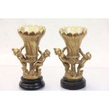 Pair of gold painted Torchere style vases with Cherubs