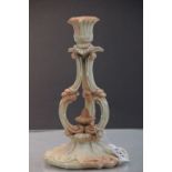 A Locke and Co. blush ivory candlestick, 23cm tall