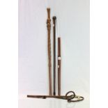 Two walking sticks, leather riding whip and far eastern wooden truncheon