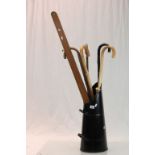 Coal scuttle with a selection of vintage walking sticks etc to include a large Military marked